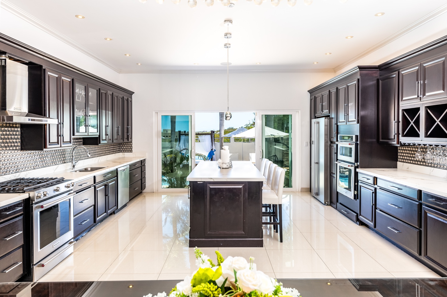 Kitchen and dining area at The White House TCI villa in Providenciales, Turks and Caicos