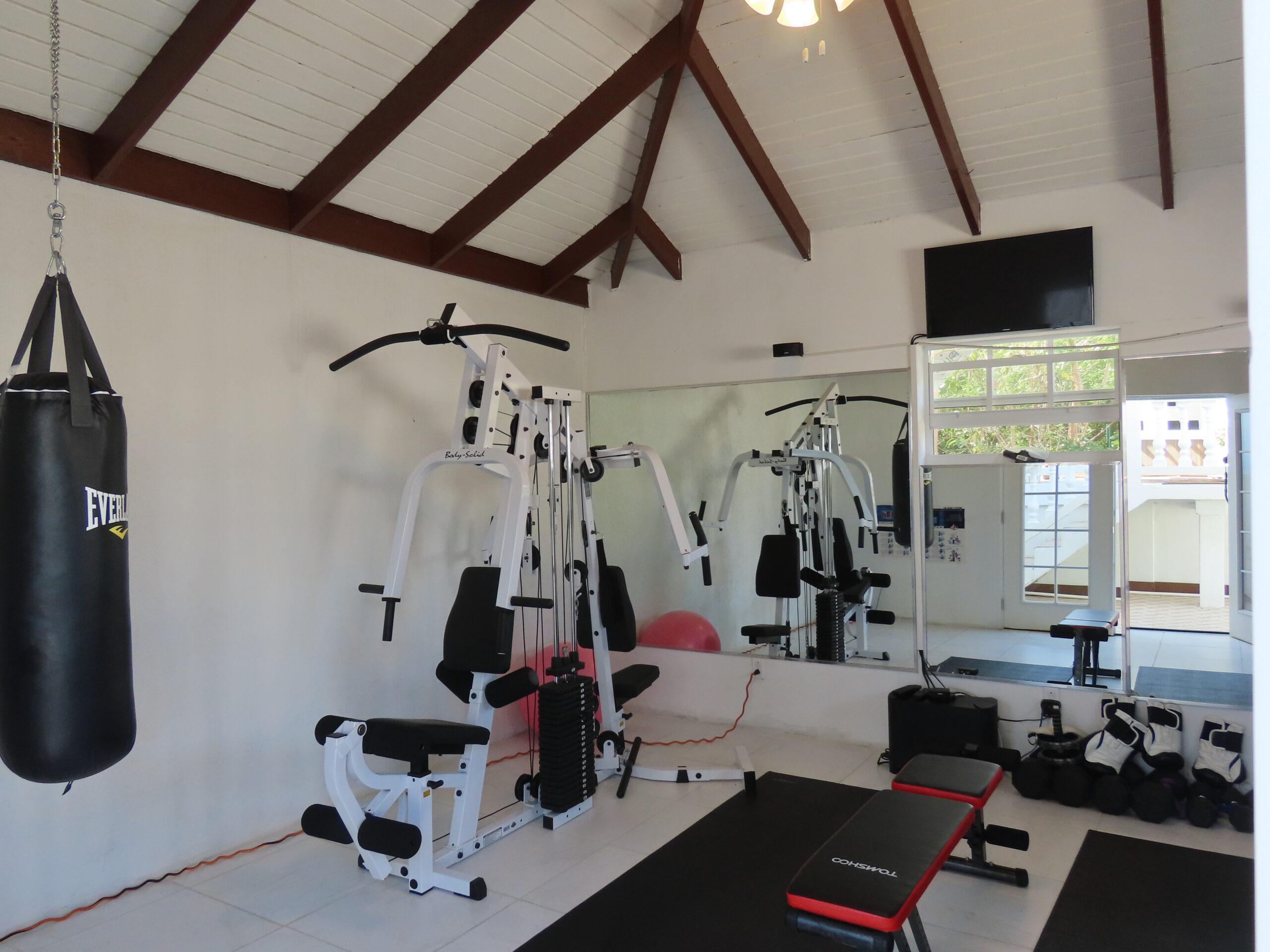 Private gym with workout equipment at The White House TCI villa