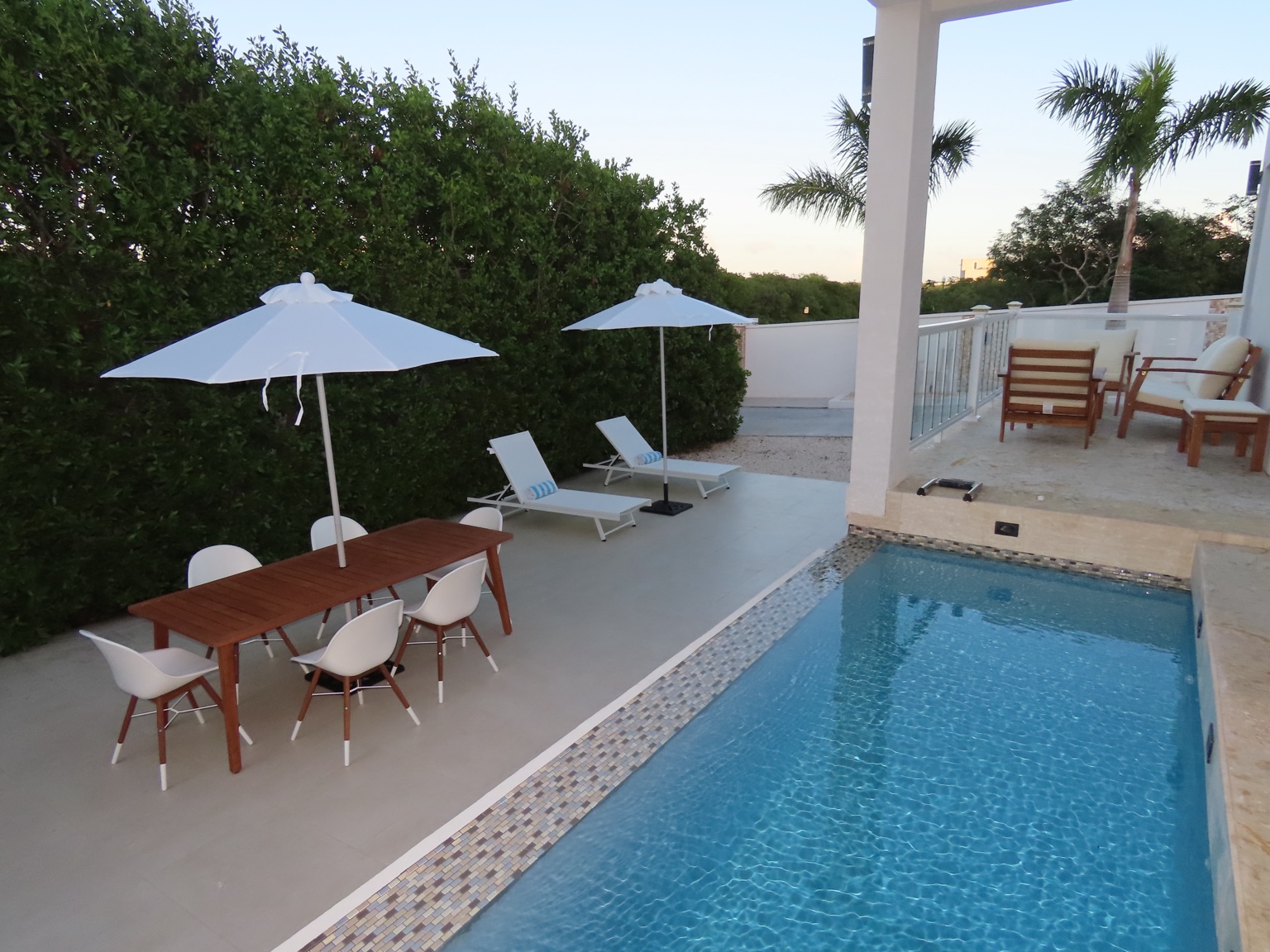 Guest house pool and terrace with outdoor dining and loungers