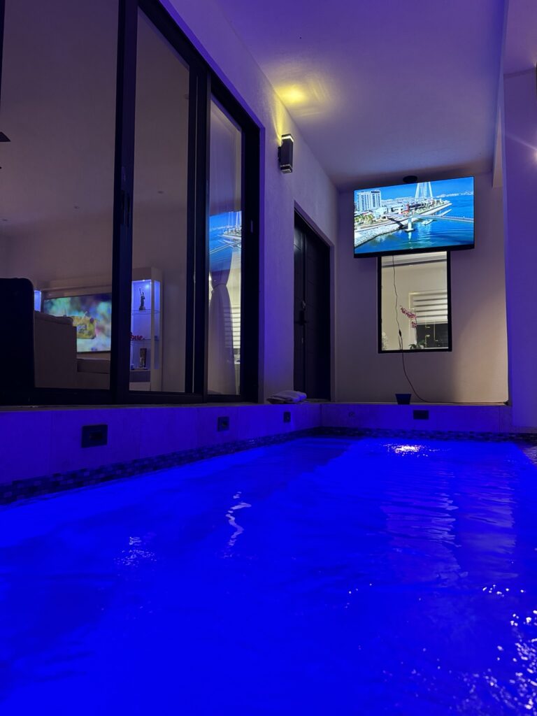 Blue-lit private pool at the guest house in Providenciales